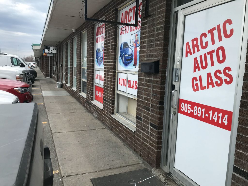 sidewalk view of Artic Auto Glass shop